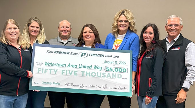 Leadership team standing with United Way representatives